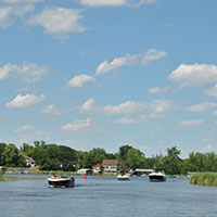 New education related law Multiple boats in a lake channel.