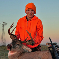 Child with harvested buck