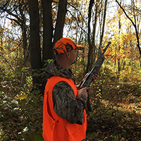 Hunter in orange vest